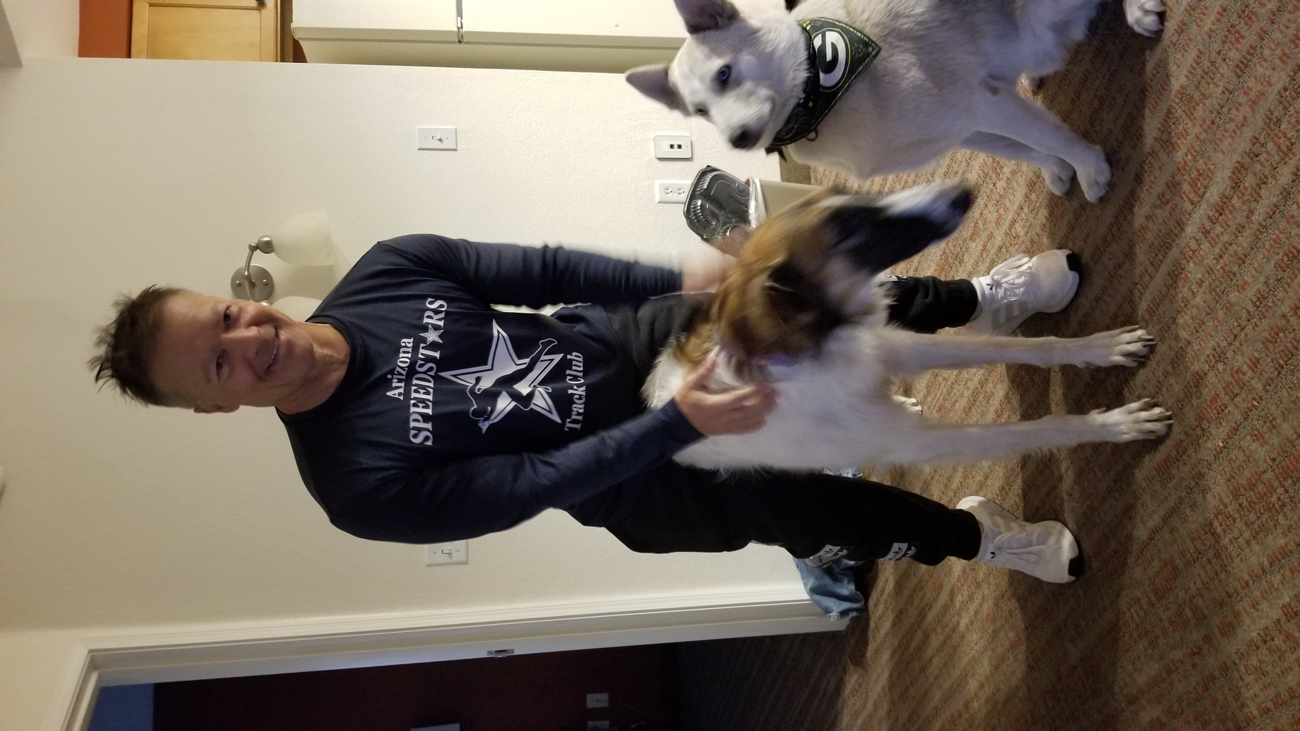 Daniel with two dogs in hotel room